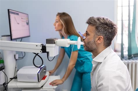 Premium Photo | Man performing pulmonary function test and spirometry ...