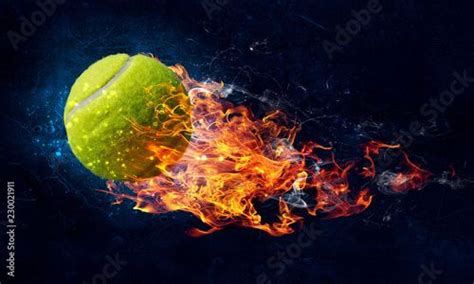 A Burning Tennis Ball In The Air With Fire And Water Around It On A