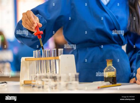 Coloured Test Tubes Photographed In A School Classroom During A Science