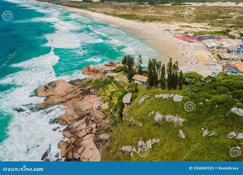 Popular Joaquina Beach With Rocks And Ocean With Waves In Brazil