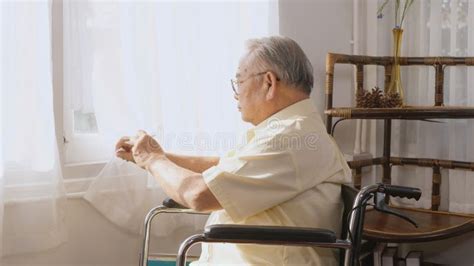 Pensive Disabled Elderly Patient Sit On Wheelchair Alone Stock Video