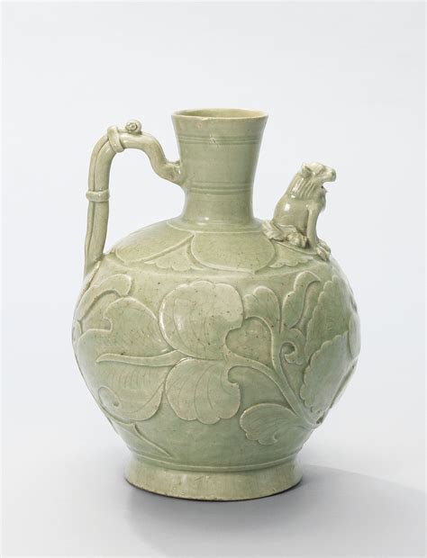 A YAOZHOU CARVED PEONY EWER FIVE DYNASTIES NORTHERN SONG DYNASTY