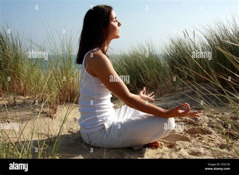Female Shoulder Length Brunette Hair Wearing White Trousers And White