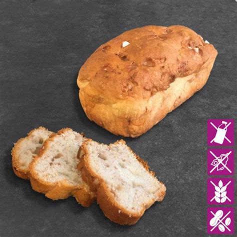 A Loaf Of Bread Sitting On Top Of A Black Counter Next To A Piece Of Bread