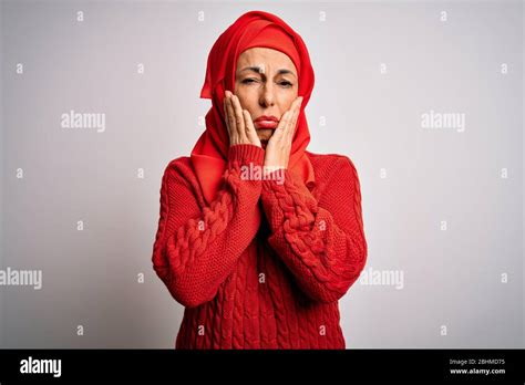 Middle Age Brunette Woman Wearing Muslim Traditional Hijab Over Isolated White Background Tired