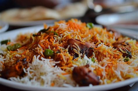 Premium Photo Indian Spicy Mutton Biryani With Raita And Gulab Jamun