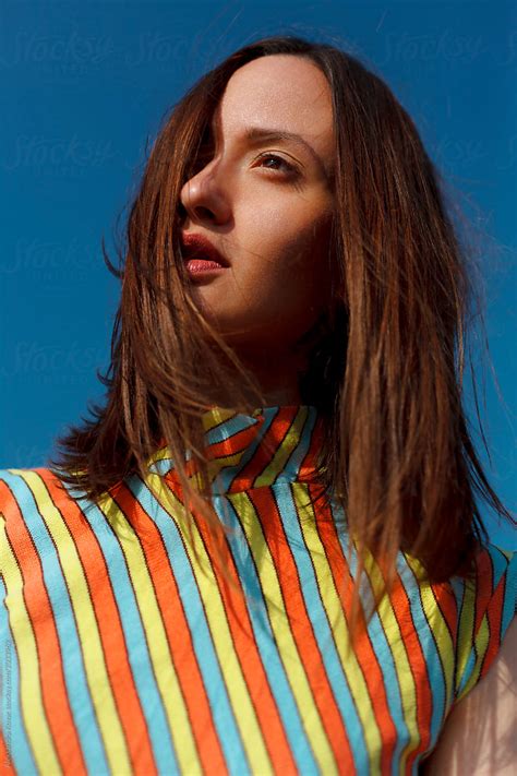 Blue Sky Brunette Woman Beauty Fashion Portrait By Stocksy Contributor Alexandra Bergam