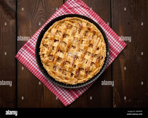 Round Baked Apple Pie On A Brown Wooden Table Top View Stock Photo Alamy