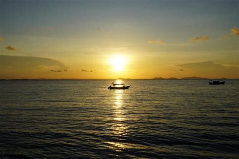 Premium Photo | Sunset view and a boat