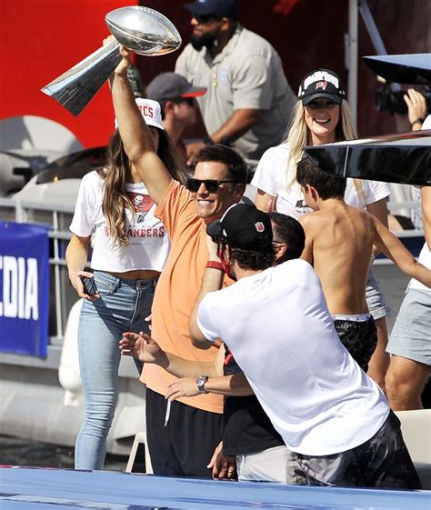 Tom Brady Throws Super Bowl Trophy Celebrating Win In Boat Parade