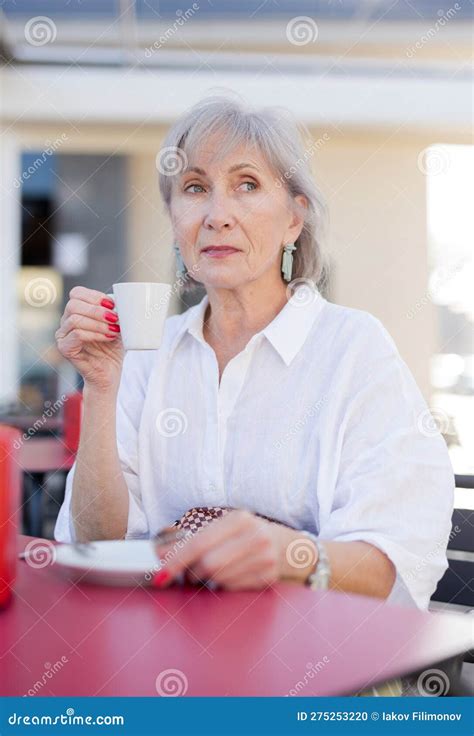 Mature Woman Drinking Coffee In Outdoor Cafe Stock Photo Image Of