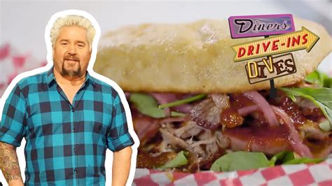 Guy Fieri Eats A Pork Brisket AND Sausage Sandwich Diners Drive Ins