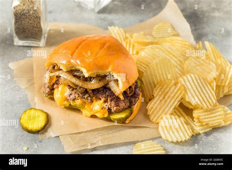 Homemade Juicy Lucy Cheeseburger with Cheddar and Chips Stock Photo - Alamy