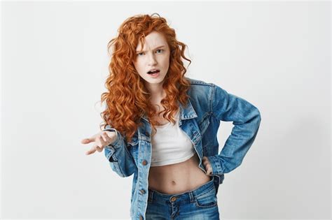 Free Photo Displeased Brutal Redhead Girl Not Understanding Copy Space