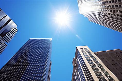 Several Buildings Stand On A Blue Sky Background Architecture City