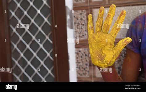 Hands Or Palms Of Young People Covered In Purple Yellow Red Blue