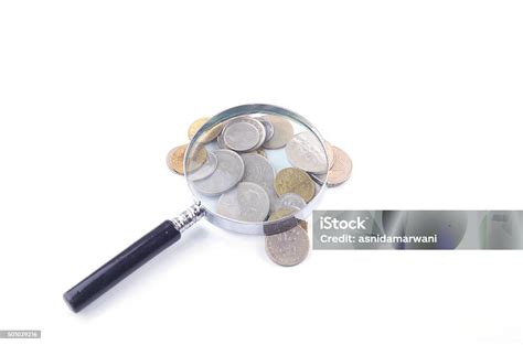 Magnifier Glass And Coin On White Background Financial Concept Stock