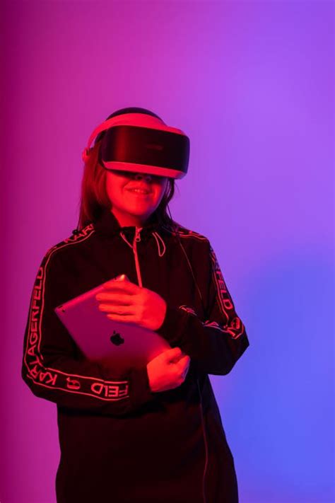 Girl Wearing Vr Headset Holding Tablet · Free Stock Photo