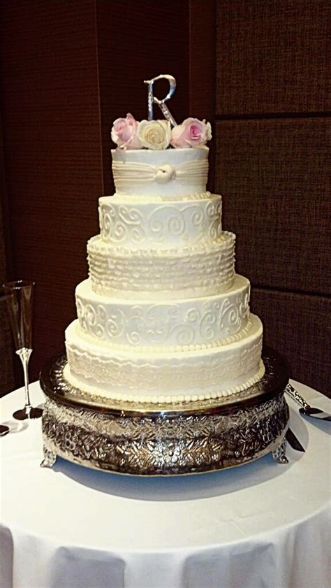 White And Ivory Wedding Cake With Buttercream Swirls And Fondant Sash