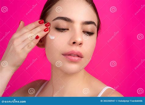 Close Up Facial Cream On Cheek Beauty Portrait Of A Beautiful Half