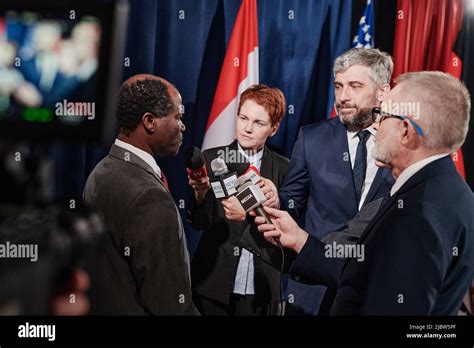 African American Political Representative Giving An Interview To Group