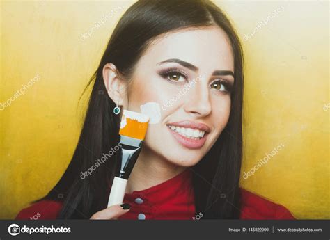 Sexy Pretty Brunette Woman Face With Artist Or Makeup Brush Stock Photo