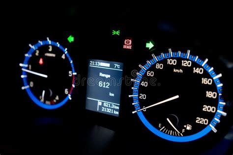 Backlit Gauges Of An Automobile Blue Glowing Meters With A Whit Stock