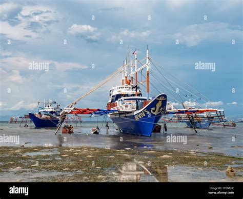 Maintenance Work Being Done On A Traditional Fishing Boat With