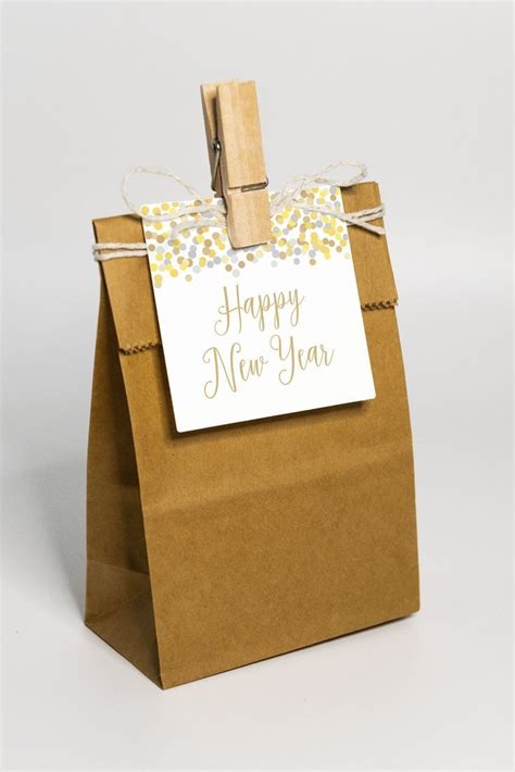 A Brown Paper Bag With A Happy New Year Tag On It