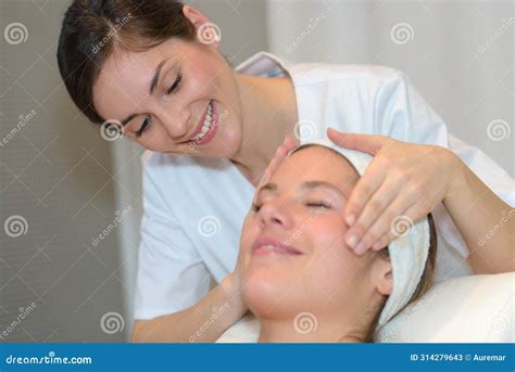 Female Beautician Doctor With Patient In Wellness Center Stock Image