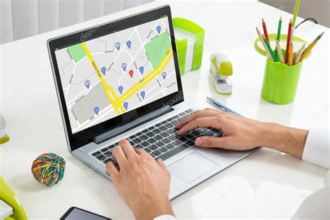 Using GPS Map On Laptop Stock Photo by ©AndreyPopov 112279982