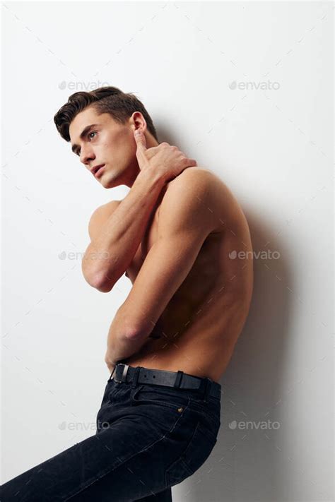 Guy With A Naked Torso Holds His Hand Behind His Head Pants Model Stock