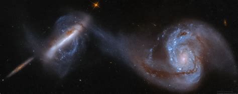 APOD - Arp 87: Merging Galaxies from Hubble