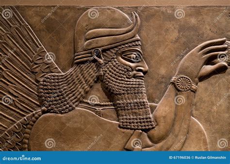 Ancient Relief of an Assyrian God Stock Photo - Image of ancient ...