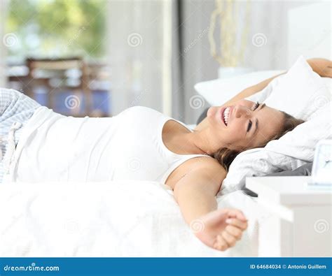 Girl Waking Up Stretching Arms On The Bed Stock Photo Image Of