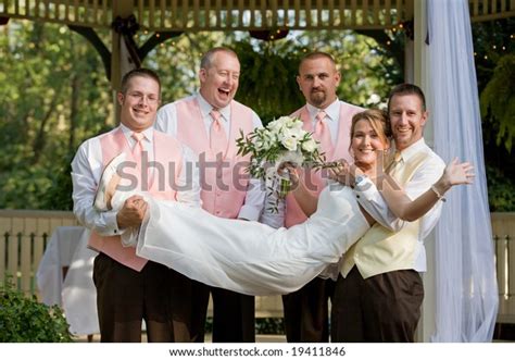 Groomsman Holding Bride Stock Photo 19411846 Shutterstock