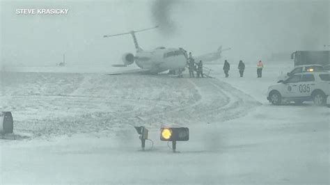 Plane Slides Off Runway At Ohare Airport In Chicago During Snowstorm