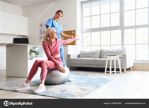 Female Physiotherapist Working Mature Woman Fitball Rehabilitation