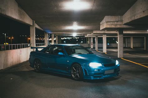 Blue Car with Headlights On · Free Stock Photo