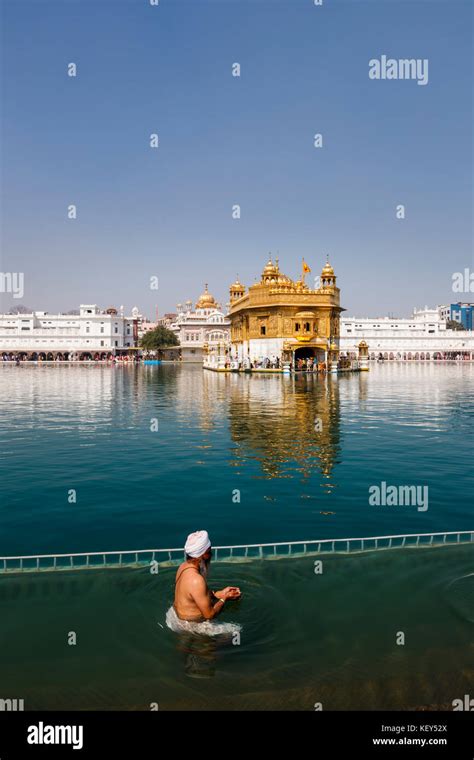 Sikh Devotee Local Man Bathing In The Pool At Golden Temple Of