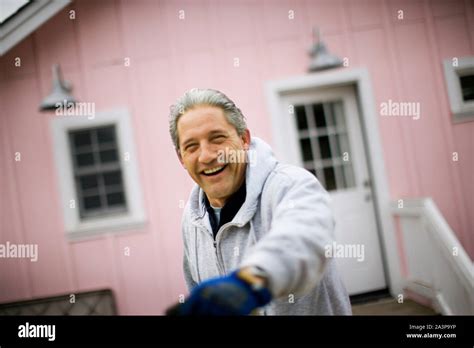 Portrait Of A Mature Construction Worker Laughing Stock Photo Alamy