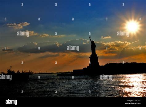 Statue of Liberty at sunset New York harbor Stock Photo - Alamy