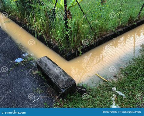 Overflowing Drain Due To Flood Disaster By Storm Water Stock Image