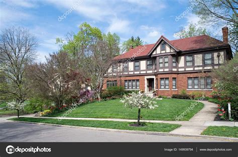 Beautifully Landscaped English Tudor Home In Spring Stock Photo By