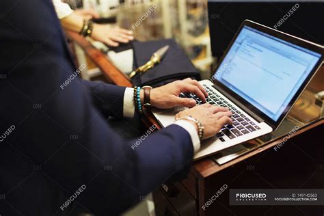 Salesman using laptop — young adult, Small Business - Stock Photo ...