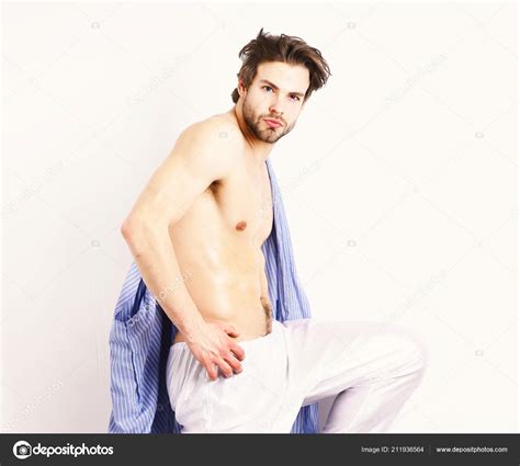 Sexy Shirtless Male Model Flirting Against White Background Stock