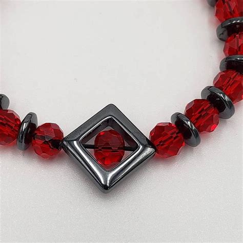 Red Faceted Glass And Hematite Beaded Bracelet Etsy Hematite Beads Hematite Bead Bracelet