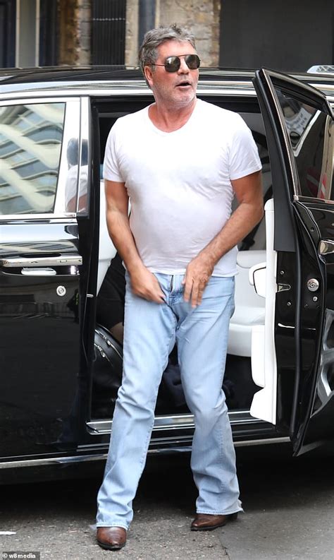 Simon Cowell Suffers Major Wardrobe Malfunction Arriving To Britains