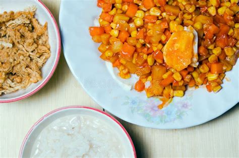 Bowl Of Rice Porridge With Shredded Pork Or Pork Floss And Salted Egg Mixed With Vegetables