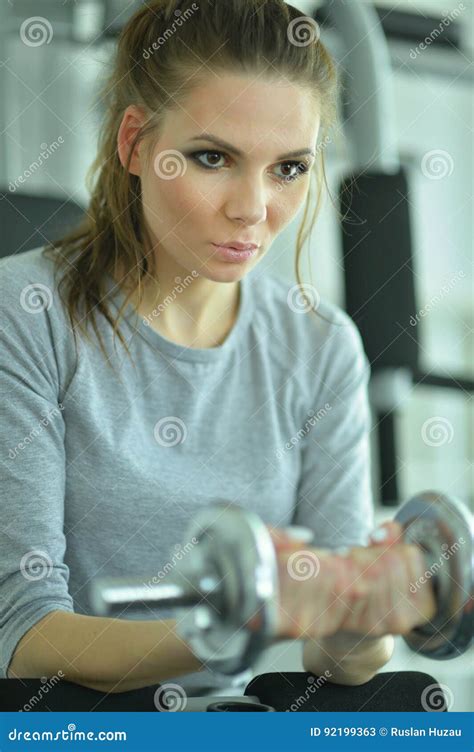 Young Woman In A Gym With A Dumbbell Stock Image Image Of Attractive